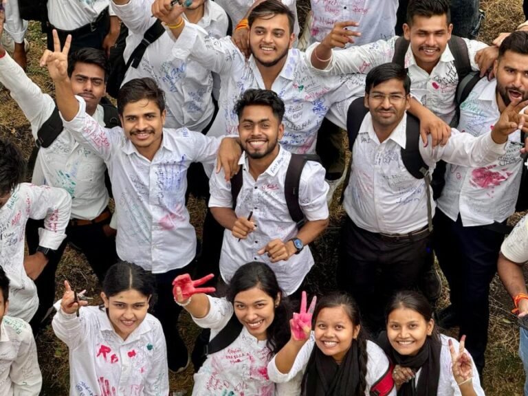 group of happy students celebrating together outdoors