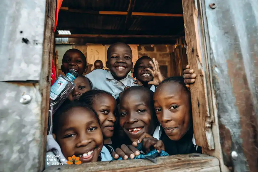 "In the heart of Tasia slum, moments of pure joy still find their way through open windows. These radiant smiles belong to students of Beyond the Vision Community School—a school that stands as more than just a learning space. It’s a safe haven, a second home, and a spark of hope in a place where opportunities are often limited. Each laugh, each curious glance through the classroom window, speaks of a brighter future. Here, education is not just about books; it’s about belonging, dreaming, and growing."- Allan Yet here, in the middle of it all, their smiles remind us what resilience looks like—and why investing in climate adaptation and community support is urgent and necessary.