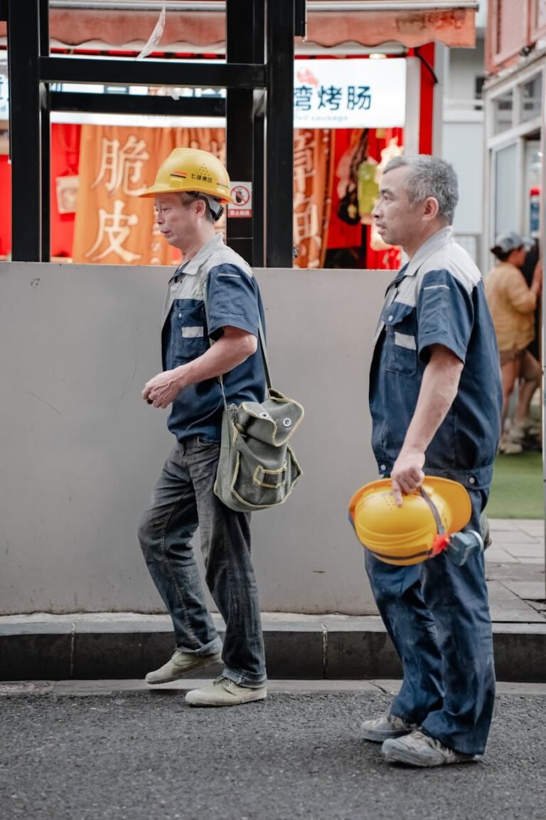 construction workers walking in urban street