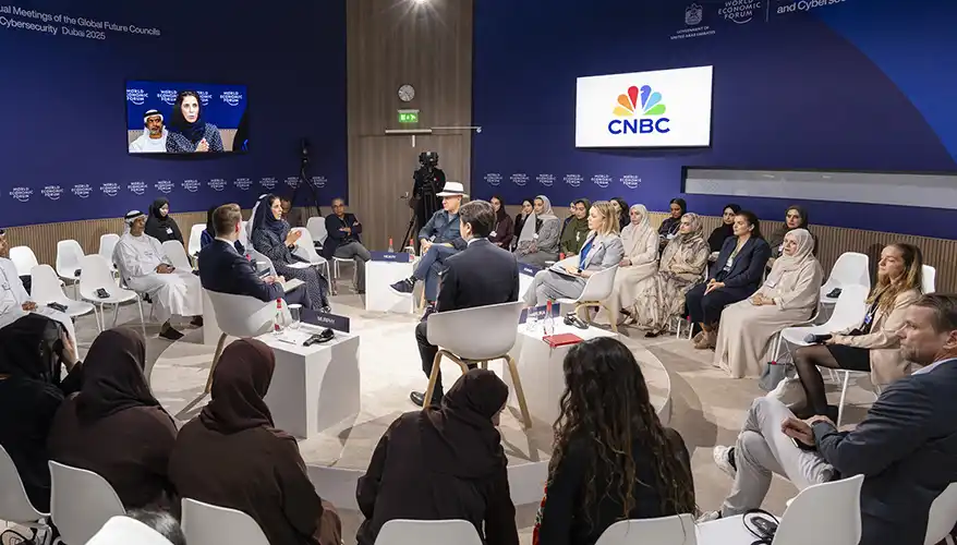 Panel discussion on regulations regarding emerging technologies at the Global Future Councils and Cybersecurity 2025 event in Dubai, featuring diverse attendees and a moderator.