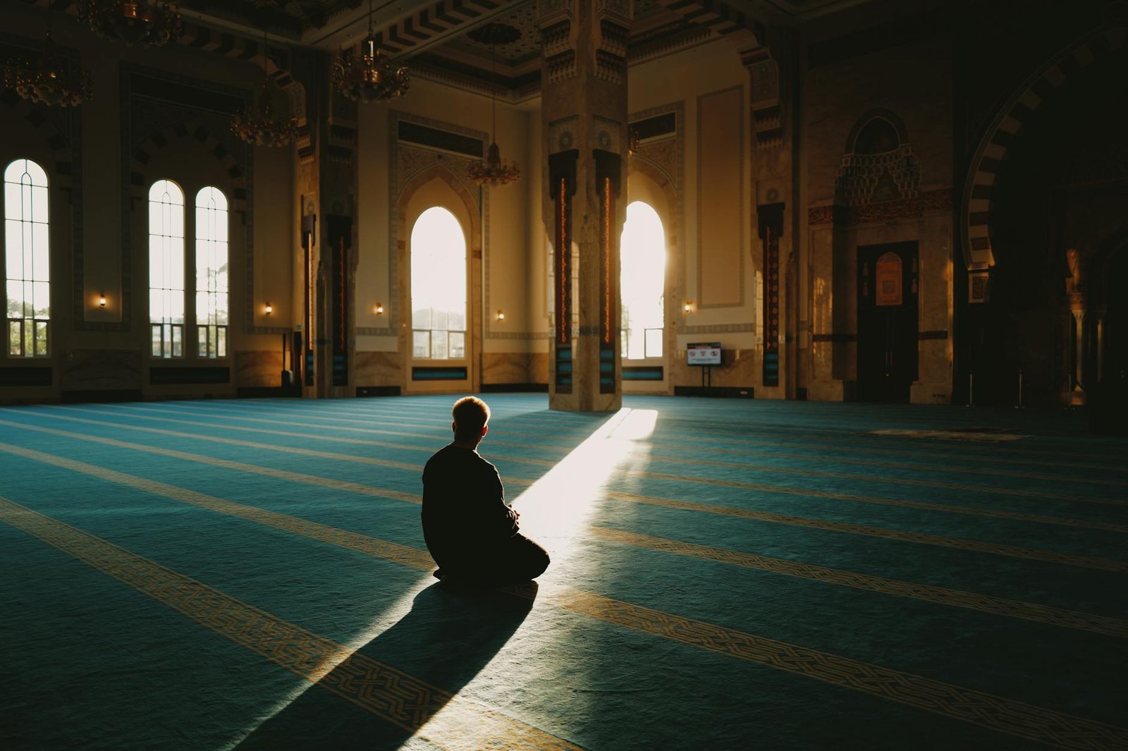 peaceful moment of prayer in serene mosque interior
