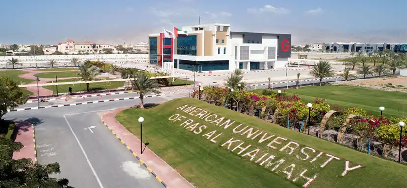 Aerial view of the American University of Ras Al Khaimah campus, showcasing modern architecture and landscaped surroundings.