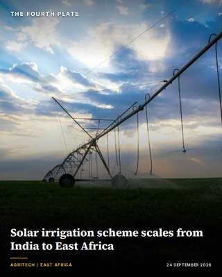 Solar-powered center-pivot irrigation sprinkler in an East African field at sunset