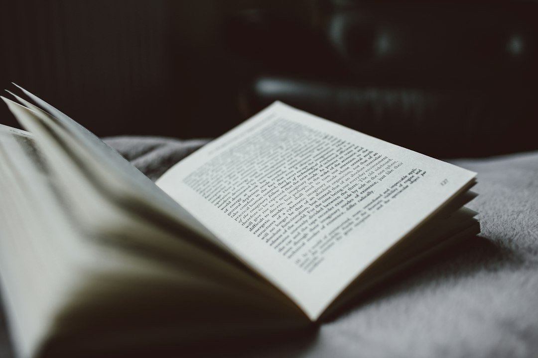 Selective focus photography of an opened textbook