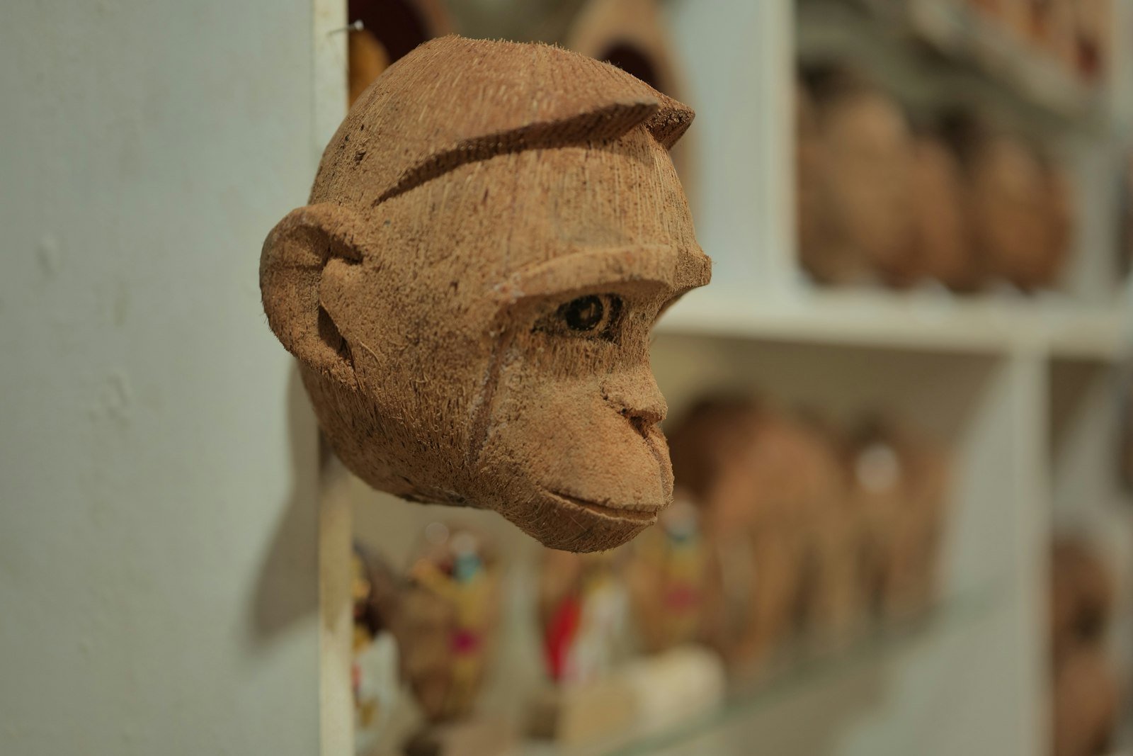 Carved coconut shell figure of a monkey head