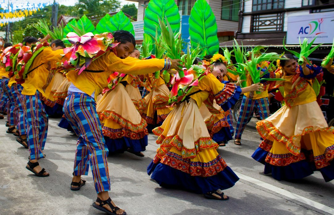 Dancers in colourful traditional costumes at a street parade