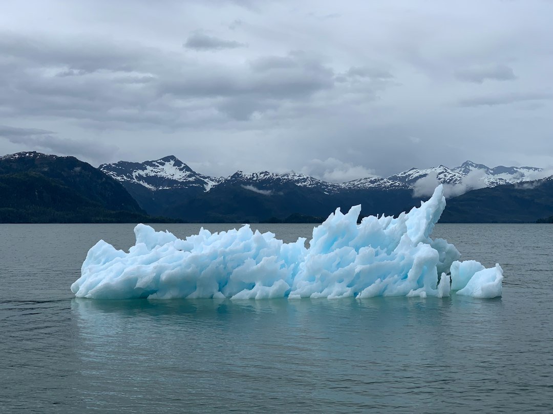 A large iceberg floating on the ocean