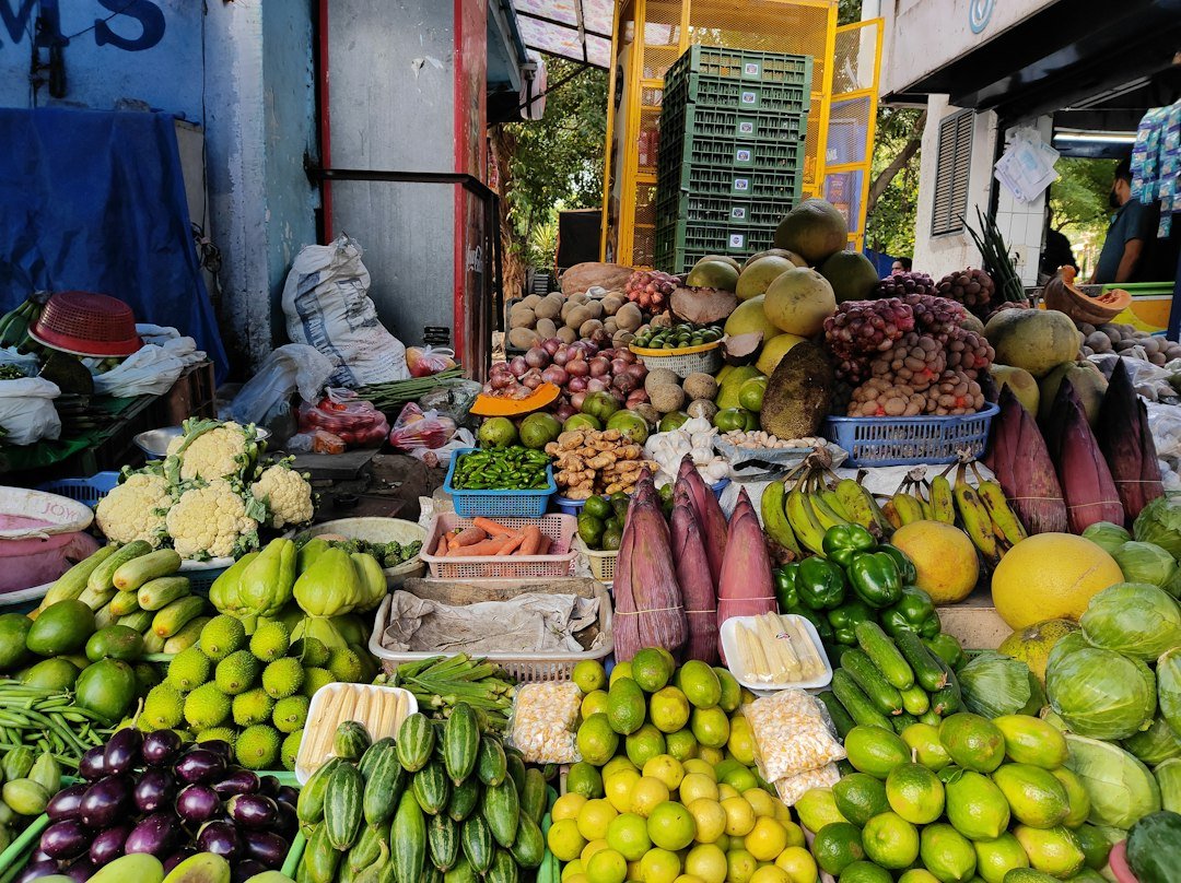 Vendor selling fresh produce at a market in Delhi, India