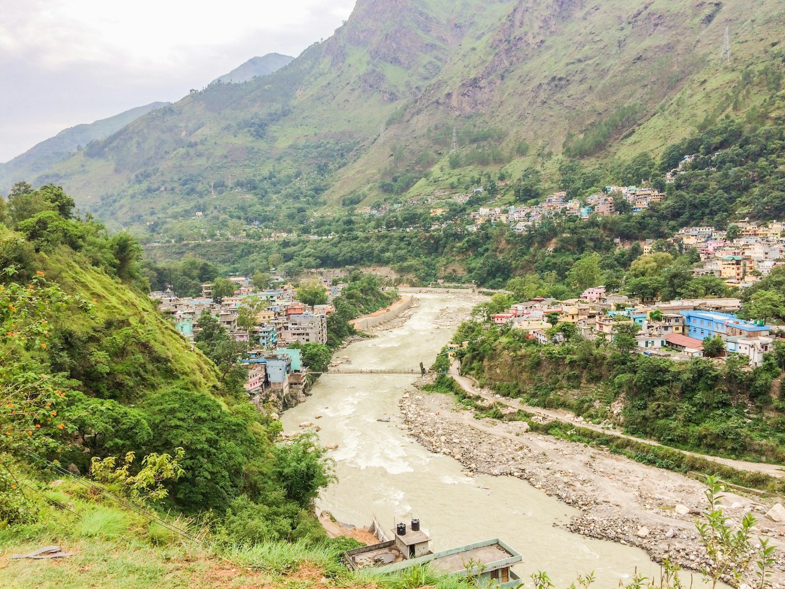 Town in a mountain valley beside a river in Nepal