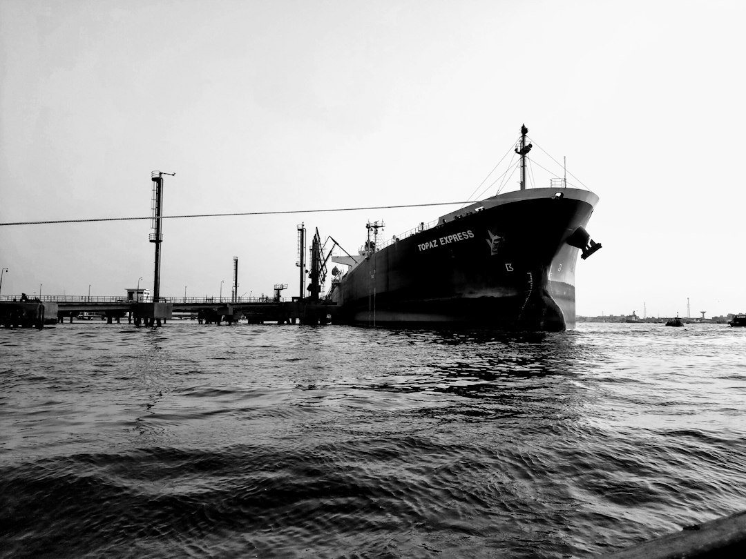 A large fishing boat floating on top of a body of water