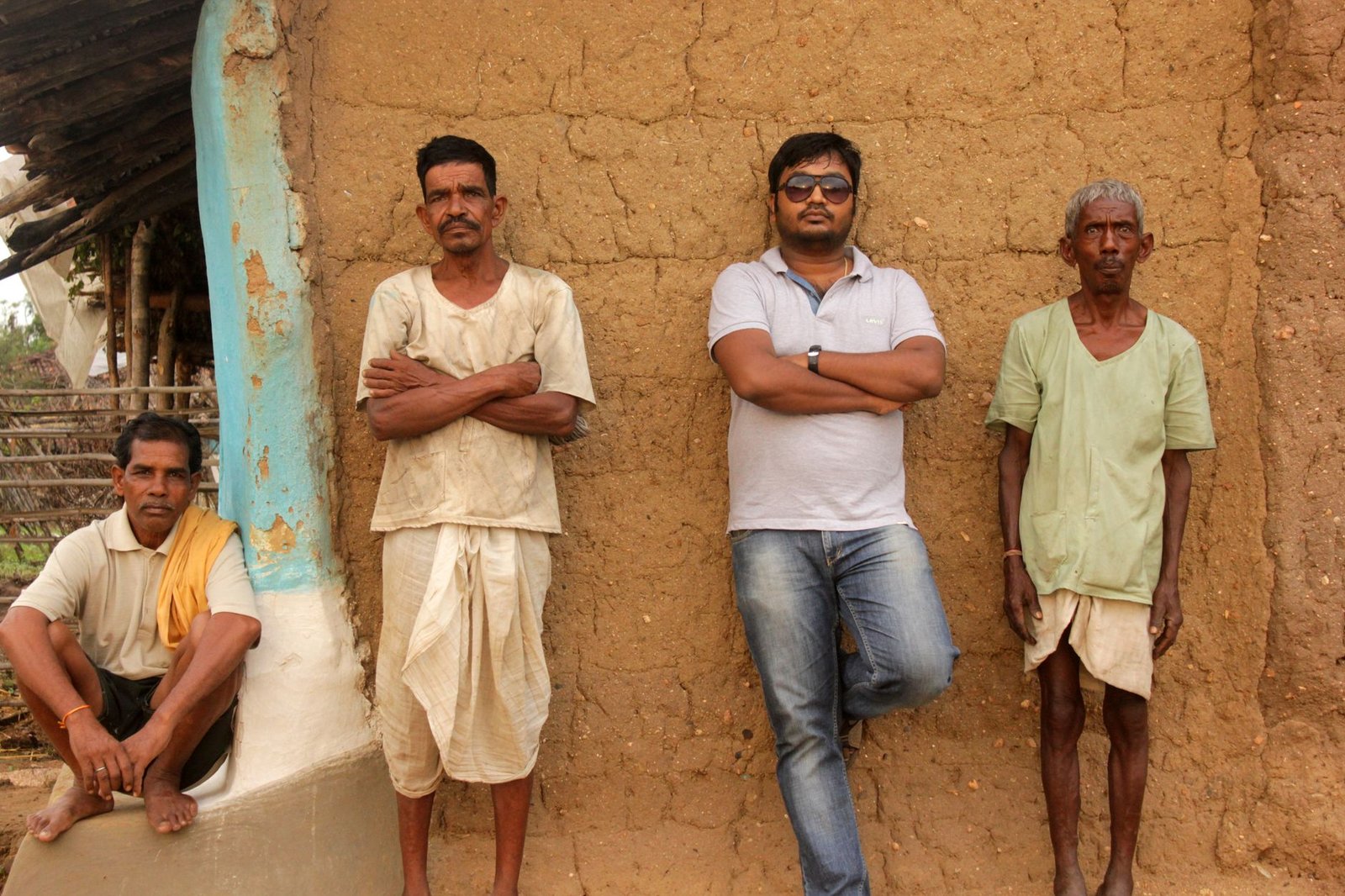 men leaning on wall