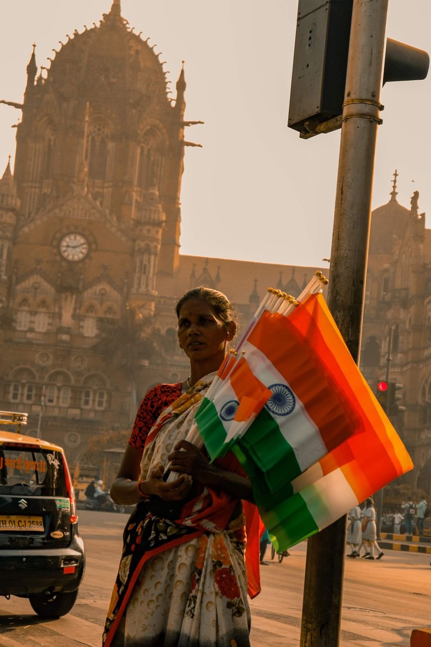 a woman holding flags