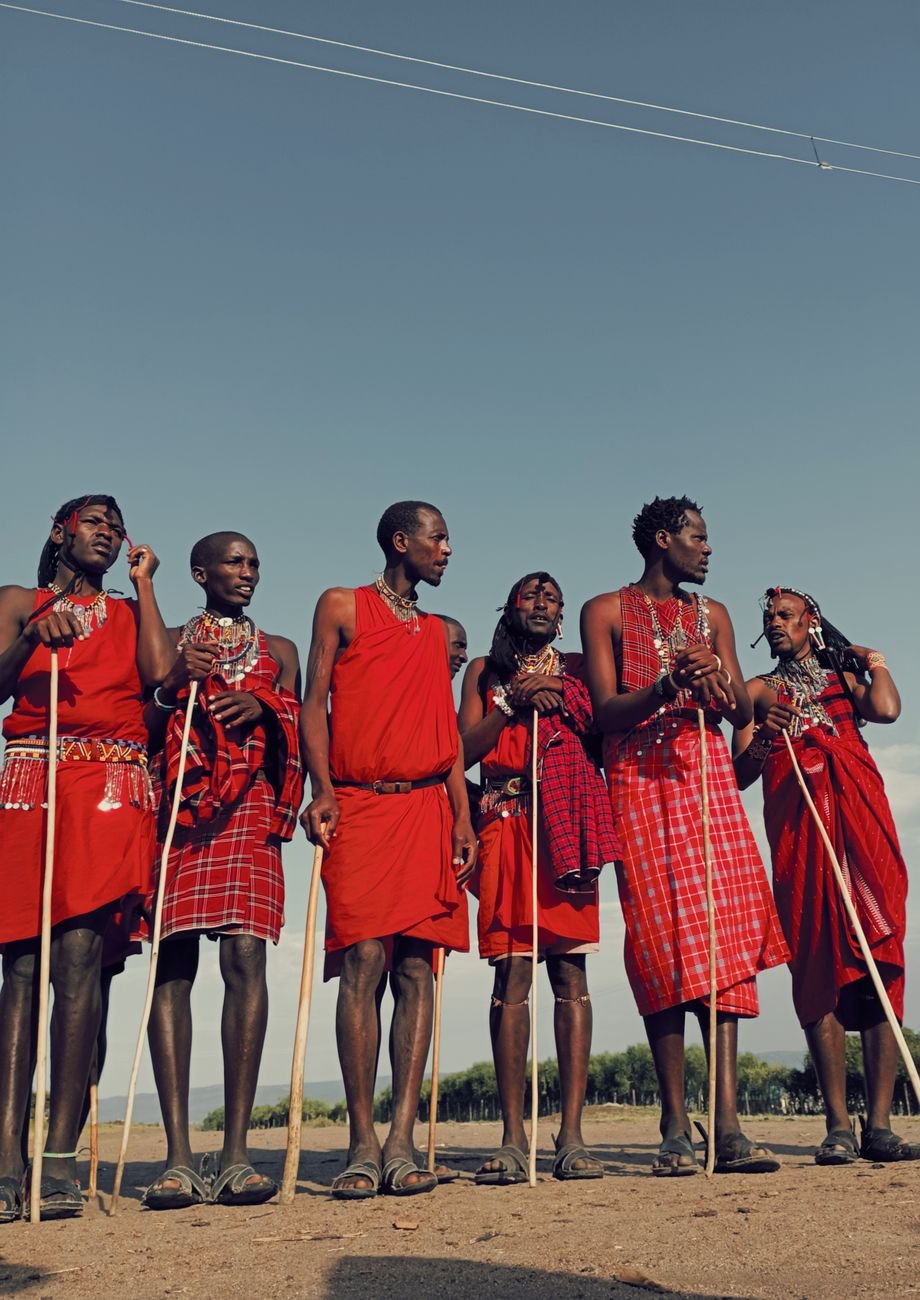 traditional maasai warriors in kenyan landscape