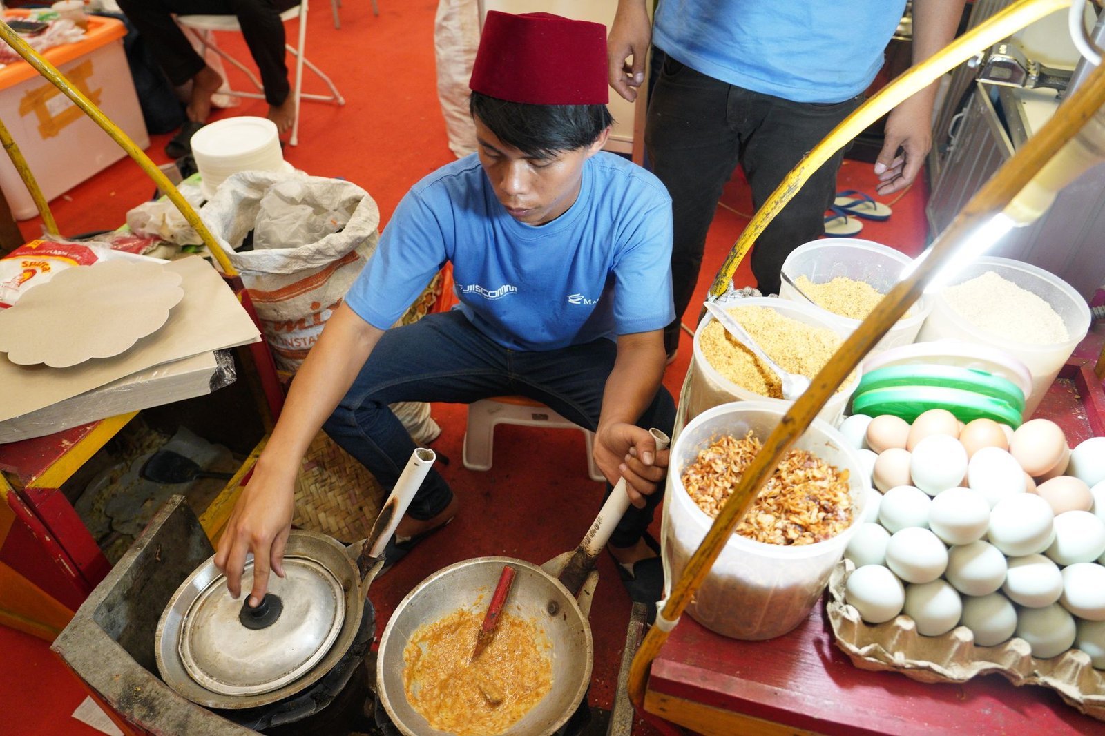 street vendor cooking traditional asian dish