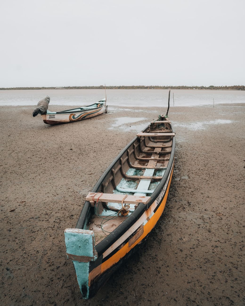 moody seascape with anchored boats in mannar
