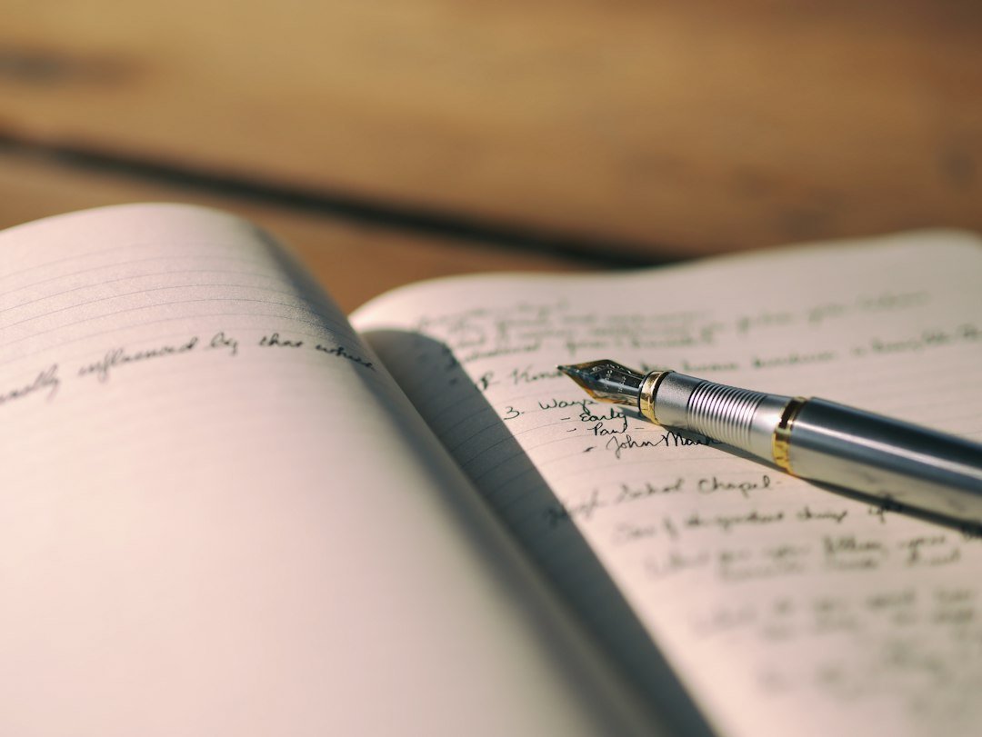 Pen on white lined paper, selective focus photography