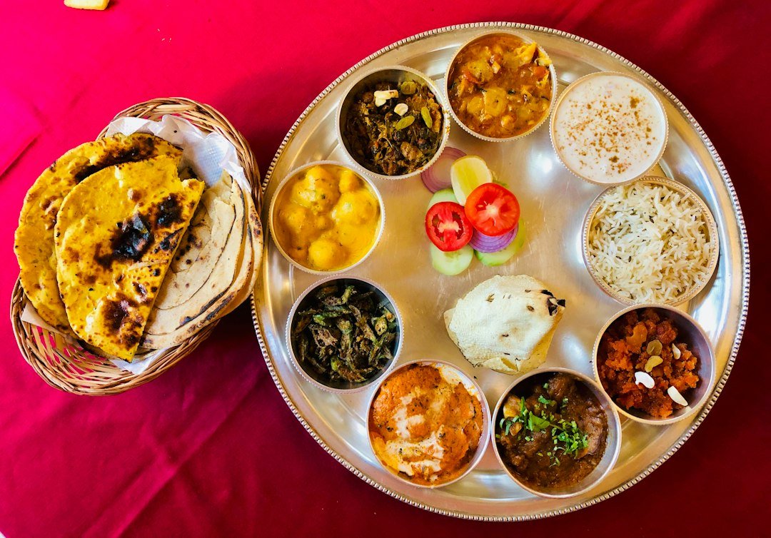 Assorted foods on a stainless steel tray