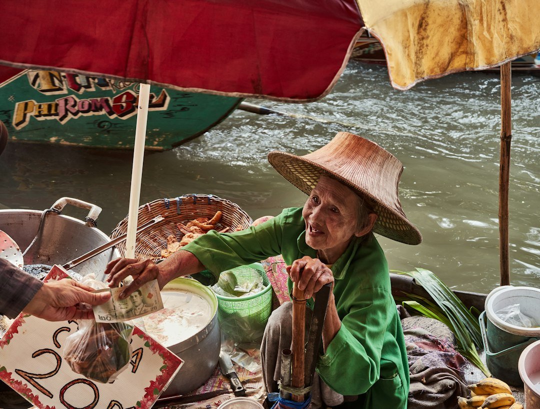 Vendor selling produce at a floating market near Bangkok