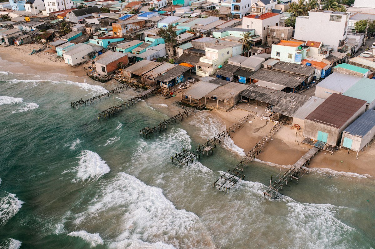 Coastal village with weathered buildings by the ocean